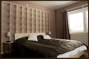 Gîte Pause Nature Saint-Hubert客房内的一张或多张床位