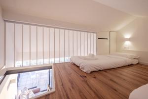 BOUTIQUE Rentals- ATTICO Luxury Design-Ocean views客房内的一张或多张床位