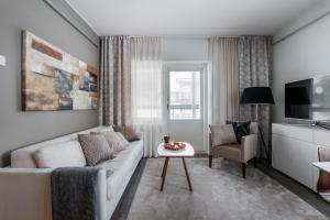 Posezení v ubytování Aateli Lakeside Chalets - former Vuokatti Suites