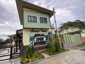 a house with a painting of an elephant on it at Piumsuk Villa in Satun