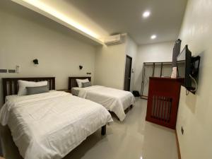 Una cama o camas en una habitación de Piumsuk Villa