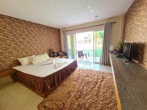 Tempat tidur dalam kamar di Phutawan Resort