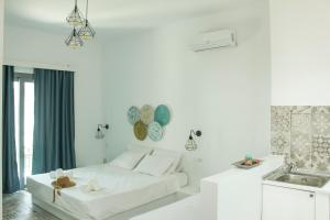 Posteľ alebo postele v izbe v ubytovaní Haraki Sea & Sun + 37 fotografií