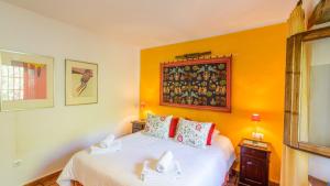 Ein Bett oder Betten in einem Zimmer der Unterkunft Finca Colores en el Viento Frigiliana by Ruralidays