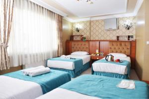 Кровать или кровати в номере Old City Viva Hotel