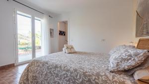 Łóżko lub łóżka w pokoju w obiekcie Casa Ami Guaro by Ruralidays