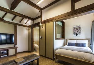 A bed or beds in a room at The Seaes Hotel & Resort