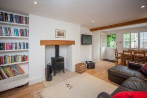 a living room with a couch and a fire place at The Bath Retreat in Bath