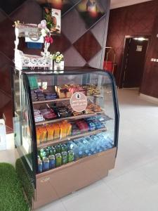 a display case filled with different types of food at Avene For Furnished Residential Units in Ad Dawādimī
