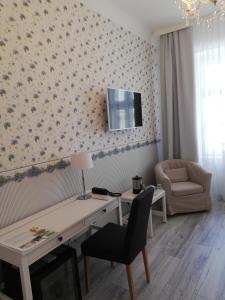 TV a/nebo společenská místnost v ubytování Boutique Hotel Kugel Wien