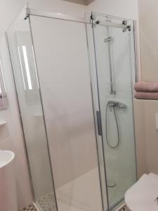 a shower with a glass door in a bathroom at Boutique Hotel Kugel Wien in Vienna