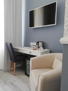 TV a/nebo společenská místnost v ubytování Boutique Hotel Kugel Wien