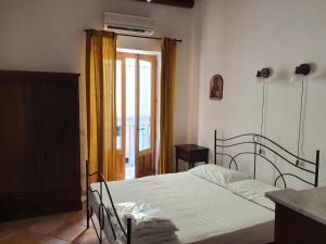 Postel nebo postele na pokoji v ubytování TORCHIO - Appartementi Il Palmento
