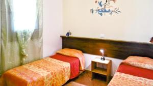 A bed or beds in a room at 3 bedrooms villa with garden and wifi at Balestrate