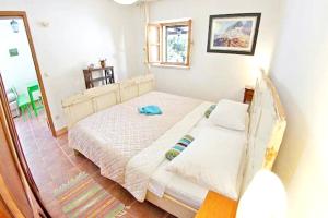 a bedroom with a bed in a room at Charming House Selca + BBQ in Selca
