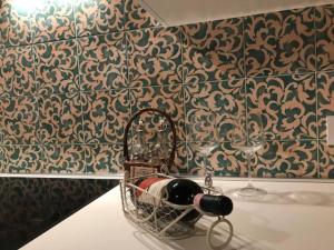 a basket on a table in a room with wallpaper at Charming apartment in Lastra a Signa with included parking in Lastra a Signa +21 photos