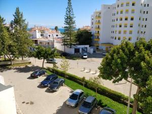 a group of cars parked in a parking lot at Sea View Apartment - Portimão - Balcony in Portimão