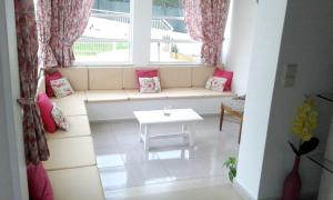 a small living room with a couch and a window at Elegant Villa in Albufeira with Private Pool. in Albufeira