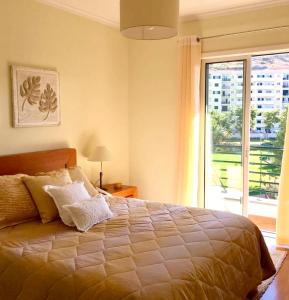 Cama o camas de una habitación en 2 bedrooms apartement with wifi at Funchal 2 km away from the beach