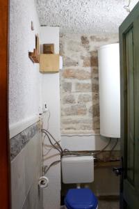 a bathroom with a toilet with a box on the wall at Charming Studio in Betina, 30 m², Terrace in Betina +46 photos