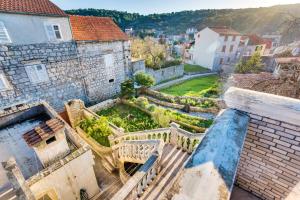 an aerial view of an old building with a garden at One bedroom apartement at Zlarin 200 m away from the beach with sea view enclosed garden and wifi in Zlarin