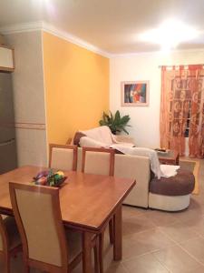 a living room with a couch and a table at Modern house in Altura with terrace and city view in Altura