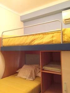 a bunk bed with the bottom bunk on top of it at Modern house in Altura with terrace and city view in Altura