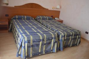 Postel nebo postele na pokoji v ubytování Hotel Parco Serrone + 37 fotografií
