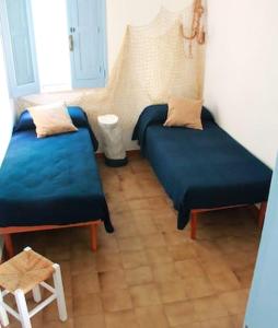 Cama ou camas em um quarto em 3 bedrooms house at Monopoli 30 m away from the beach with enclosed garden and wifi