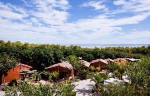 an aerial view of a resort with the ocean in the background at Camping Ribamar in Alcossebre