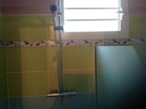 a shower with a glass door in a bathroom at Appartement de 2 chambres avec balcon et wifi a Les Abymes a 7 km de la plage in Les Abymes