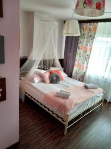 a bedroom with a bed with a canopy at Willa Polka in Bukowina Tatrzańska