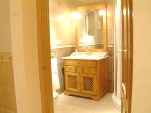 a bathroom with a sink and a mirror at Charming Villa with Private Pool in La Calzada de Béjar in La Calzada de Béjar +15 photos