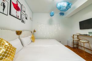 Letto o letti in una camera di W Homestay