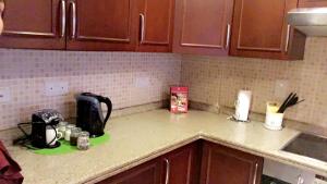 a kitchen counter top with a coffee maker on it at مسكن الشاطئ Beach House in King Abdullah Economic City