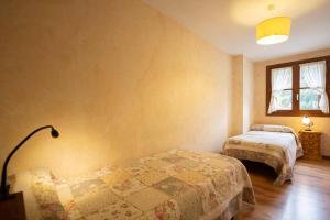 Łóżko lub łóżka w pokoju w obiekcie Apartamentos Onki Xin