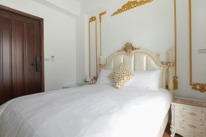 Letto o letti in una camera di W Homestay