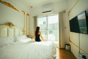 Letto o letti in una camera di W Homestay