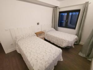 Postel nebo postele na pokoji v ubytování VILLA MAREL