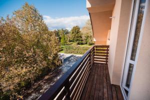 a balcony of a house with a view of trees at Rooms Vila Medena in Brežice
