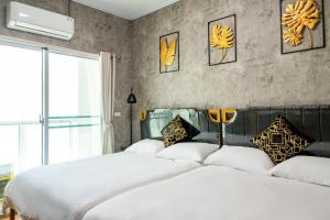 Letto o letti in una camera di W Homestay