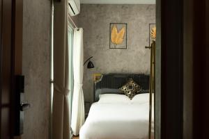 Letto o letti in una camera di W Homestay