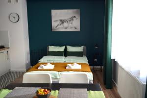 Posteľ alebo postele v izbe v ubytovaní ForRest Apartment Krynica