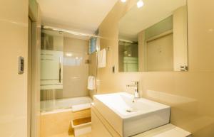 a white bathroom with a sink and a shower at Hotel Los Tambos Colonial in Arequipa +114 photos