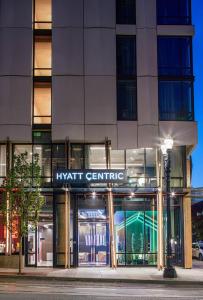 a building with a sign on the front of it at Hyatt Centric Downtown Portland in Portland