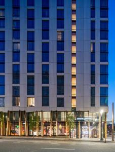 a tall building with a street in front of it at Hyatt Centric Downtown Portland in Portland