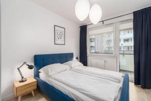 Postel nebo postele na pokoji v ubytování FARO Apartamenty Bliżej Morza