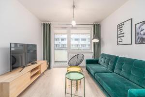TV a/nebo společenská místnost v ubytování FARO Apartamenty Bliżej Morza