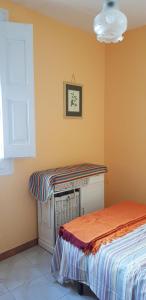A bed or beds in a room at Piso romantico y espacioso