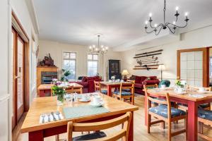 a dining room and living room with a table and chairs at Courthouse Inn Revelstoke in Revelstoke